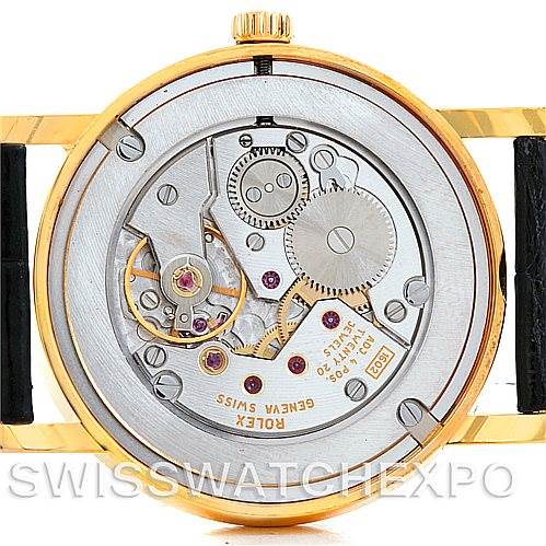 This image shows the back view of the Rolex Cellini 5115 Men's Yellow Gold Beige Dial 5115 Men's Yellow Gold Beige Dial watch, highlighting its internal mechanical components.