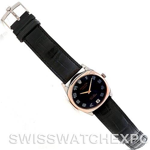 This image shows an overhead view of a Rolex Cellini 4233 Men's White Gold Black Dial 4233 Men's White Gold Black Dial watch, displaying its black leather strap, square dial, and silver buckle.