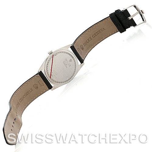 This image shows the back of a Rolex Cellini 4233 Men's White Gold Black Dial 4233 Men's White Gold Black Dial watch and its leather strap, positioned to display the clasp and case back.