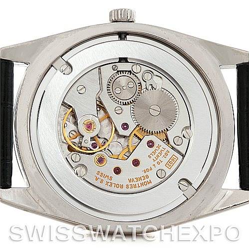 The image shows the back of a Rolex Cellini 4233 Men's White Gold Black Dial 4233 Men's White Gold Black Dial watch, revealing its inner mechanical movement.