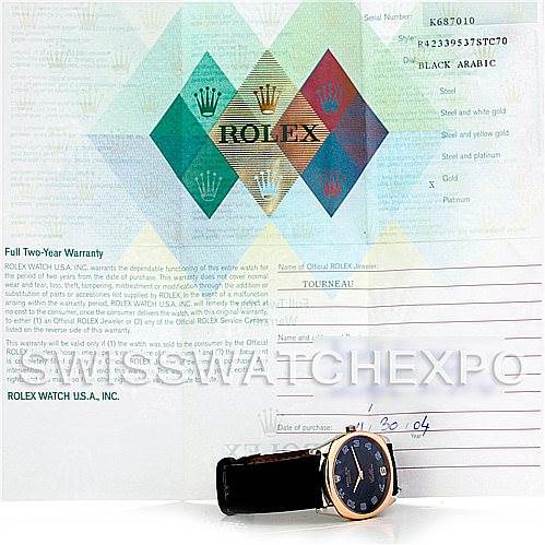 The image shows a Rolex Cellini 4233 Men's White Gold Black Dial 4233 Men's White Gold Black Dial watch positioned at an angle with the front dial and part of the strap visible, displayed against a warranty document.