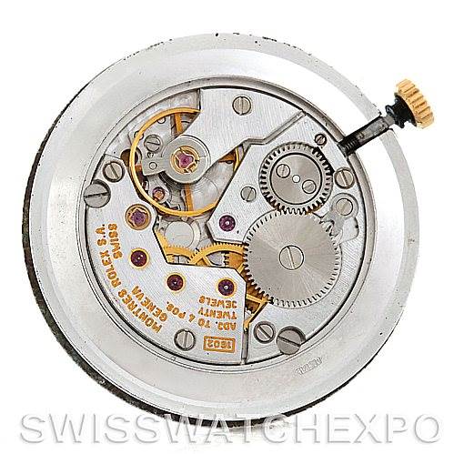 This image shows the internal mechanism of a Rolex Cellini 4112 Men's Yellow Gold White Dial 4112 Men's Yellow Gold White Dial watch, highlighting gears, screws, and the winding crown.
