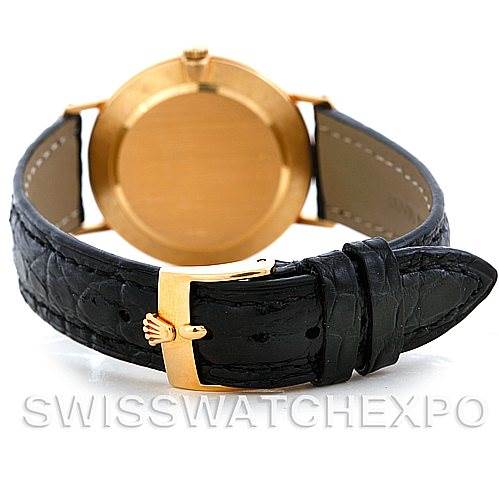 This image shows the back of the Rolex Cellini 4112 Men's Yellow Gold White Dial 4112 Men's Yellow Gold White Dial watch, focusing on the black leather strap and gold buckle.