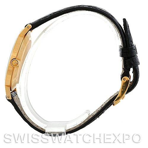 The image shows a side view of a Rolex Cellini 4112 Men's Yellow Gold White Dial 4112 Men's Yellow Gold White Dial watch, highlighting its gold case, crown, and black leather strap.