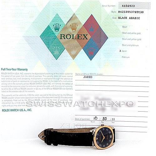 The image features a Rolex Cellini 4233 Men's White Gold Black Dial 4233 Men's White Gold Black Dial watch positioned flat with its face visible, alongside its warranty card and documentation.