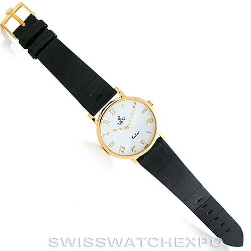 The image shows a Rolex Cellini 5112 Men's Yellow Gold White Dial 5112 Men's Yellow Gold White Dial watch at an angled top-down view, displaying the face, case, strap, and buckle.