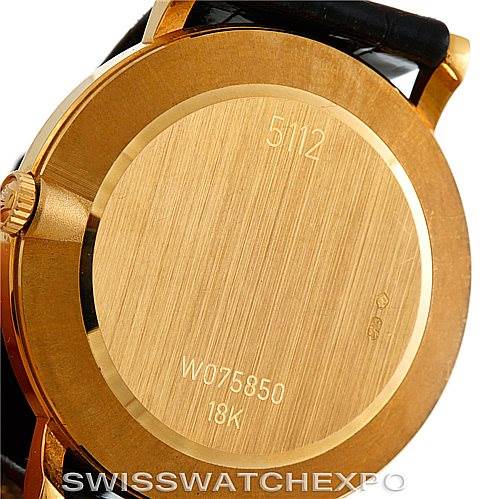 The image shows the back case of a Rolex Cellini 5112 Men's Yellow Gold White Dial 5112 Men's Yellow Gold White Dial watch, highlighting its 18K gold material and engraved serial numbers.