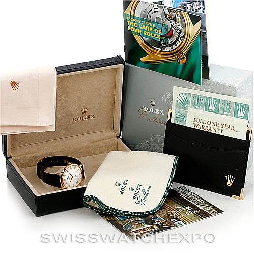 The image shows a Rolex Cellini 5112 Men's Yellow Gold White Dial 5112 Men's Yellow Gold White Dial watch with its box, warranty card, booklet, cloth, and other accessories from an angled top view.