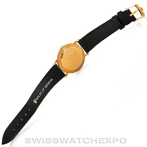 The image shows the back view of a Rolex Cellini 5112 Men's Yellow Gold White Dial 5112 Men's Yellow Gold White Dial watch with a black strap and gold casing.