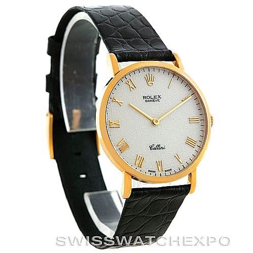 This image shows a Rolex Cellini 5112 Men's Yellow Gold Beige Dial 5112 Men's Yellow Gold Beige Dial watch at an oblique angle, highlighting the watch face, gold case, and black leather strap.