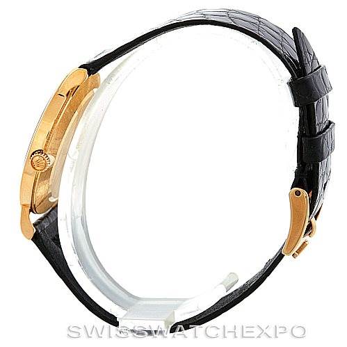 The image shows a side view of a Rolex Cellini 5112 Men's Yellow Gold Beige Dial 5112 Men's Yellow Gold Beige Dial model watch, highlighting its slim profile and black leather strap.