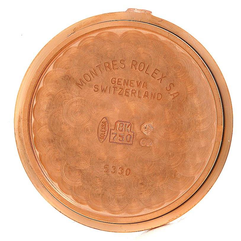 This image shows the back cover of a Rolex Cellini 5330 Men's Rose Gold Grey Dial 5330 Men's Rose Gold Grey Dial watch, displaying inscriptions and gold purity marks.