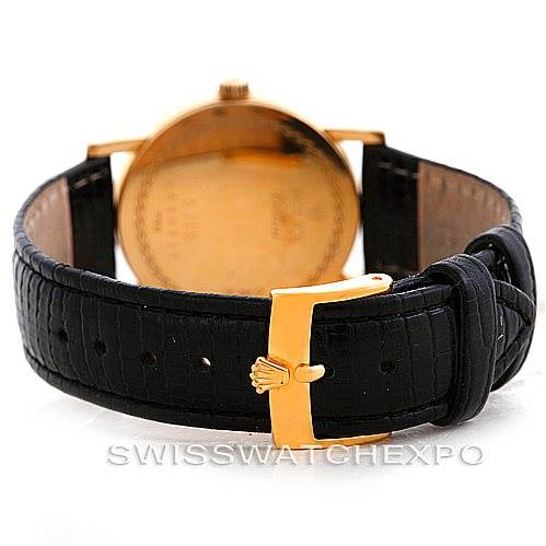 This image shows the back of a Rolex Cellini 5115 Men's Yellow Gold Beige Dial 5115 Men's Yellow Gold Beige Dial watch, highlighting the leather strap and gold buckle.