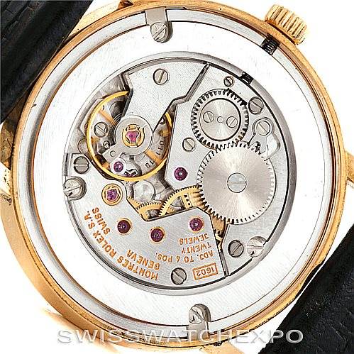 This image shows the back view of a Rolex Cellini 5115 Men's Yellow Gold Beige Dial 5115 Men's Yellow Gold Beige Dial watch, highlighting its intricate internal mechanisms and movement.