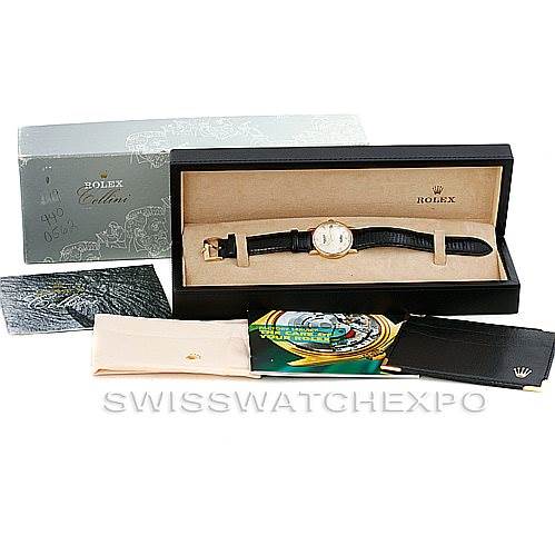 The image shows a Rolex Cellini 5115 Men's Yellow Gold Beige Dial 5115 Men's Yellow Gold Beige Dial watch displayed in its box with additional accessories and packaging visible.