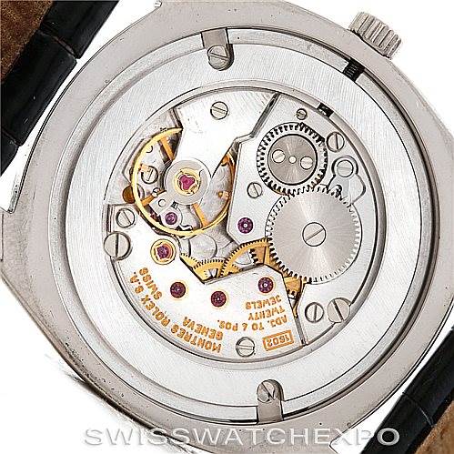 The image shows the back of a Rolex Cellini 4233 Men's White Gold White Dial 4233 Men's White Gold White Dial watch, displaying its intricate mechanical movement.