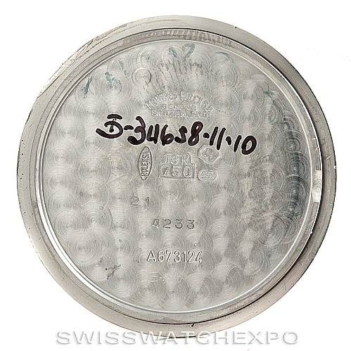 This image shows the case back of a Rolex Cellini 4233 Men's White Gold White Dial 4233 Men's White Gold White Dial watch, viewed from an overhead angle, displaying internal markings and serial numbers.