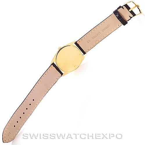 This Rolex Cellini 4233 Men's Yellow Gold Black Dial 4233 Men's Yellow Gold Black Dial watch is shown from the back, displaying its leather strap, buckle, and caseback.