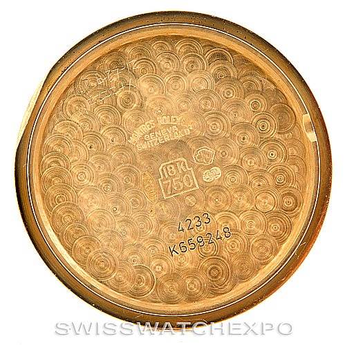 This image shows the interior of the case back for a Rolex Cellini 4233 Men's Yellow Gold Black Dial 4233 Men's Yellow Gold Black Dial watch with various engravings and identification marks.