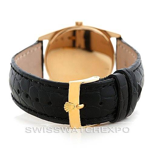 The image shows the back of a Rolex Cellini 4233 Men's Yellow Gold Black Dial 4233 Men's Yellow Gold Black Dial watch, highlighting its black leather strap and gold buckle.