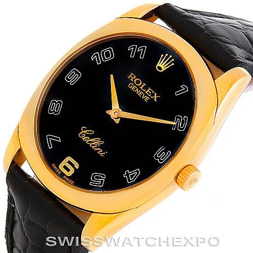 This image shows a Rolex Cellini 4233 Men's Yellow Gold Black Dial 4233 Men's Yellow Gold Black Dial watch from an oblique angle, highlighting its gold casing, black dial, and leather strap.