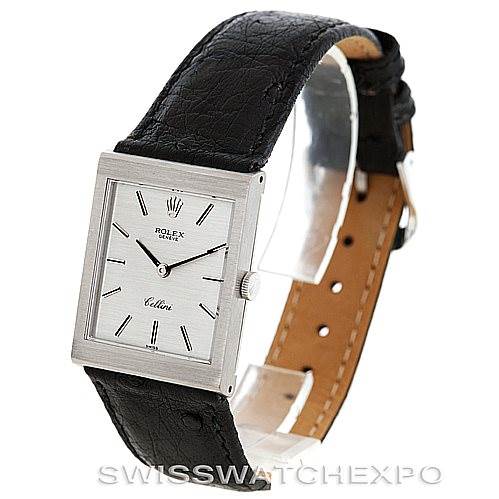 This image shows a Rolex Cellini 4014 Men
s White Gold Silver Dial 4014 Men
s White Gold Silver Dial watch at a three-quarter angle, highlighting its rectangular face, dial, and black leather strap.
