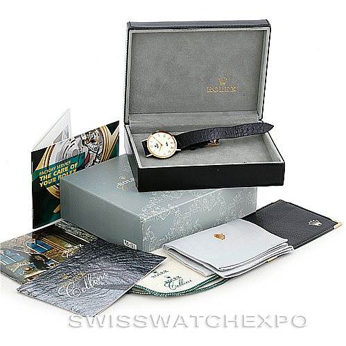 The image shows a Rolex Cellini 4112 Men's Yellow Gold White Dial 4112 Men's Yellow Gold White Dial watch with its original box, booklets, cloths, and outer packaging, viewed from the front.