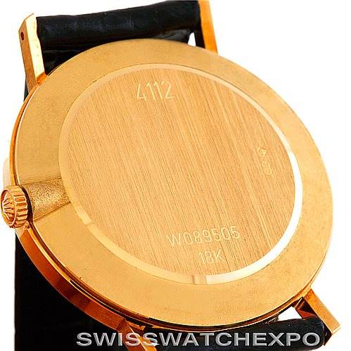 This image shows the back case of a Rolex Cellini 4112 Men's Yellow Gold White Dial 4112 Men's Yellow Gold White Dial watch, featuring its gold finish and markings.