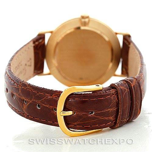 This image shows the back and buckle of a Rolex Cellini 4112 Men's Yellow Gold Champagne Dial 4112 Men's Yellow Gold Champagne Dial watch with a brown leather strap.