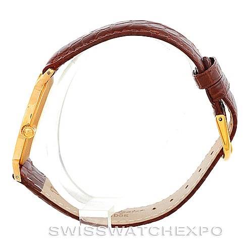 The Rolex Cellini 4112 Men's Yellow Gold Champagne Dial 4112 Men's Yellow Gold Champagne Dial watch is shown in a side profile angle, displaying the slim case, crown, and brown leather strap.