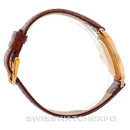 This side view of the Rolex Cellini 4112 Men's Yellow Gold Champagne Dial 4112 Men's Yellow Gold Champagne Dial watch showcases the leather strap, gold buckle, and case profile.