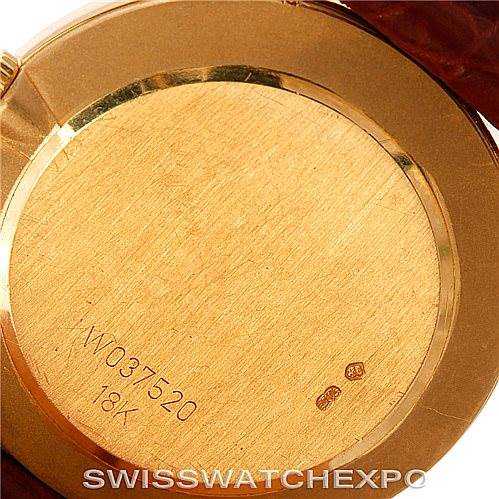 The image shows the case back of a Rolex Cellini 4112 Men's Yellow Gold Champagne Dial 4112 Men's Yellow Gold Champagne Dial watch with visible serial number and 18K gold marking.