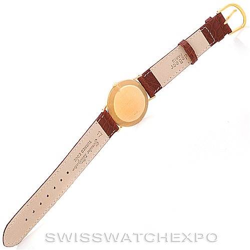 This image shows the back of the watch and the entire leather strap of a Rolex Cellini 4112 Men's Yellow Gold Champagne Dial 4112 Men's Yellow Gold Champagne Dial model, laid flat.