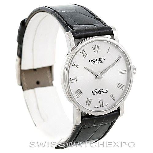 The image shows a Cellini model by Rolex at a three-quarters angle, highlighting the watch's face and leather strap.