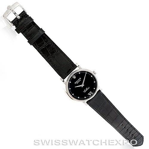 The image shows a top-down view of a Rolex Cellini 5115 Men's White Gold Black Dial 5115 Men's White Gold Black Dial watch, displaying its black leather strap and black dial.