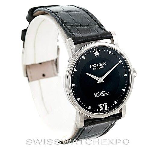 The image shows a Rolex Cellini 5115 Men's White Gold Black Dial 5115 Men's White Gold Black Dial watch at an angled side view, featuring its black dial, silver indices, and leather strap.