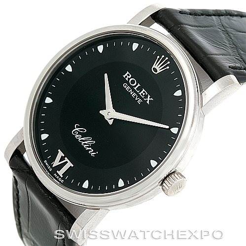 This image showcases a Rolex Cellini 5115 Men's White Gold Black Dial 5115 Men's White Gold Black Dial watch from a tilted angle, highlighting the black dial, crown, and part of the black leather strap.