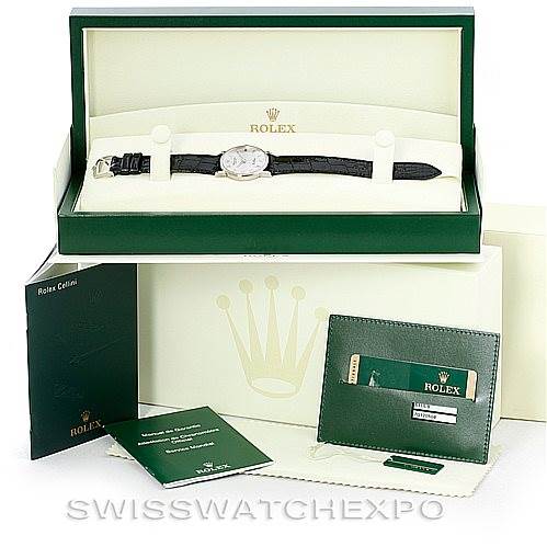 This image shows a Rolex Cellini 5115 Men's White Gold Silver Dial 5115 Men's White Gold Silver Dial watch, displayed in its open box with accompanying booklets and warranty card holder.