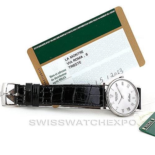 The image shows a Rolex Cellini 5115 Men's White Gold Silver Dial 5115 Men's White Gold Silver Dial watch, lying flat, displaying its strap, face, and buckle, along with its authenticity card.