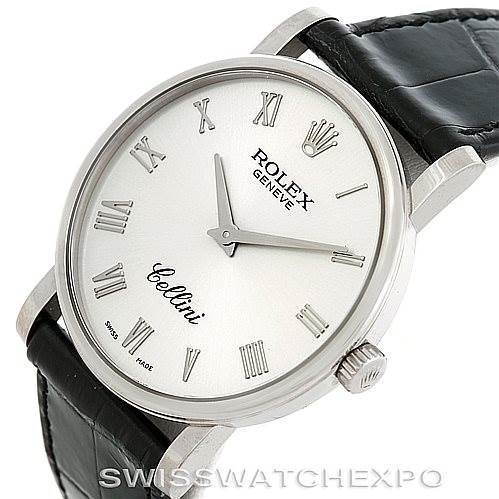 The image shows a Rolex Cellini 5115 Men's White Gold Silver Dial 5115 Men's White Gold Silver Dial watch at a slight angle, highlighting its dial, Roman numerals, brand markings, and leather strap.