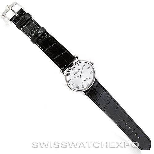 The image shows a top view of a Rolex Cellini 5115 Men's White Gold Silver Dial 5115 Men's White Gold Silver Dial watch with a black leather strap and a silver case and dial.