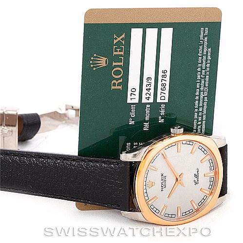 This image shows a Rolex Cellini 4243 Men's White Gold Silver Dial 4243 Men's White Gold Silver Dial watch at an angle displaying the face, strap, and registration card.