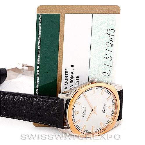 The image shows a Rolex Cellini 4243 Men's White Gold Silver Dial 4243 Men's White Gold Silver Dial watch with a black leather strap and warranty card from a front angle.
