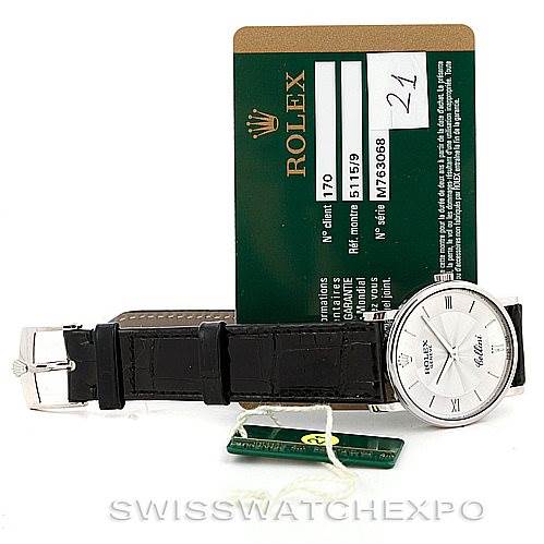 The image shows a Rolex Cellini 5115 Men's White Gold Silver Dial 5115 Men's White Gold Silver Dial watch lying flat with both the face and strap visible, alongside its green certificate card.