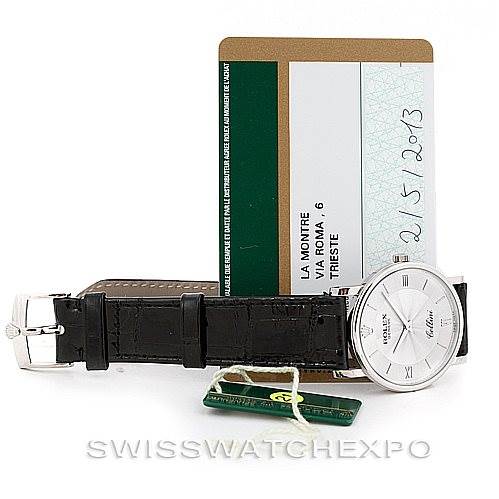 This image shows a Rolex Cellini 5115 Men's White Gold Silver Dial 5115 Men's White Gold Silver Dial watch with a black leather strap, shot from a top-down angle, alongside its certification cards.