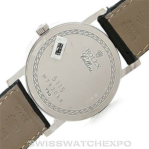 The image shows the back case of a Rolex Cellini 5115 Men's White Gold Silver Dial 5115 Men's White Gold Silver Dial watch, displaying the model and serial numbers along with leather straps.