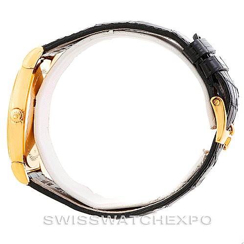 The image shows a side view of a Rolex Cellini 5330 Men's Yellow Gold White Dial 5330 Men's Yellow Gold White Dial watch, displaying its gold case, crown, and black leather strap with a clasp.