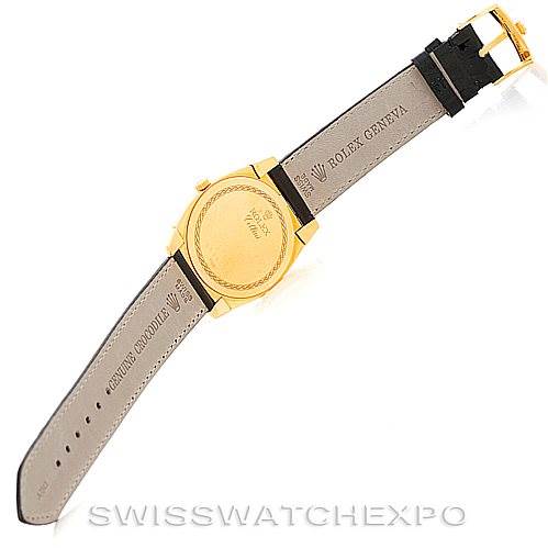 This image shows the back of the Rolex Cellini 5330 Men's Yellow Gold White Dial 5330 Men's Yellow Gold White Dial watch, highlighting its golden case and leather strap.