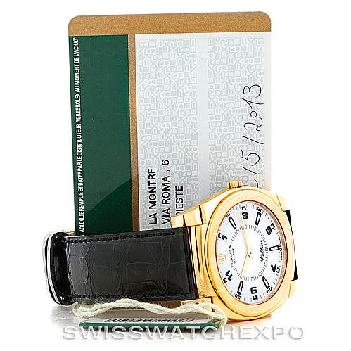 The image shows a Rolex Cellini 5330 Men's Yellow Gold White Dial 5330 Men's Yellow Gold White Dial watch from an angled front view, including its black leather strap and accompanying documentation.