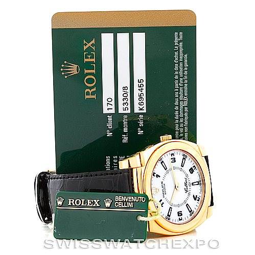 The image shows a Rolex Cellini 5330 Men's Yellow Gold White Dial 5330 Men's Yellow Gold White Dial watch at an angle displaying its face, band, and attached tags, with a Rolex authentication card in the background.